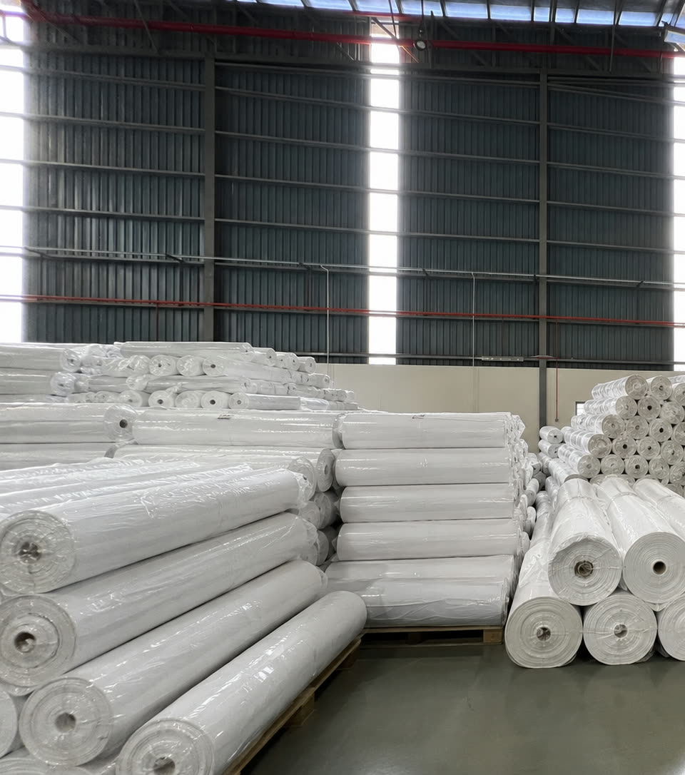 Rolls of white AeroTex geotextile stacked inside the Bandar Sri Sendayan plant